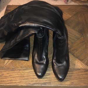 Thigh high heeled leather boots
